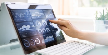 A tablet screen displaying multiple charts.