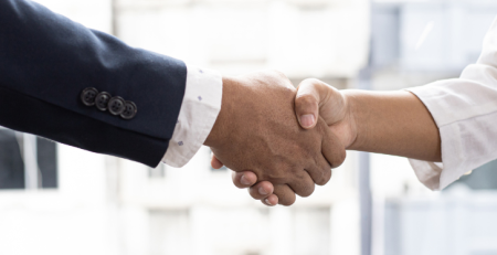 A handshake between two professionals.