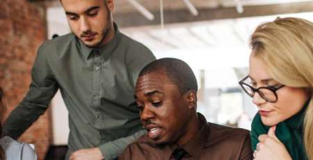 A team of colleagues working together in an office.