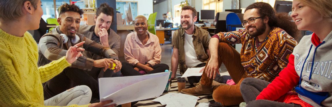 A group of Gen Z employees in a laid-back office setting.
